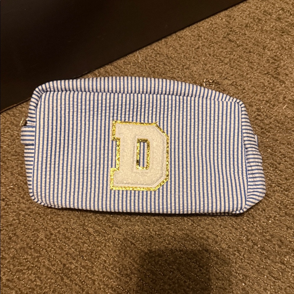 Two Striped Blue & White Cosmetic Pouch with Gold-Trim D Patch